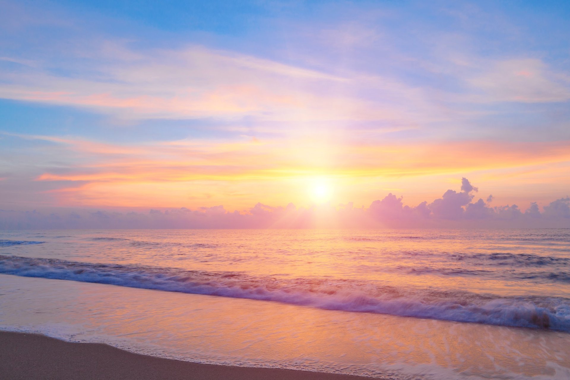 Bright sunrise or sunset over the beach an impressive at Hua Hin beach, Thailand.
